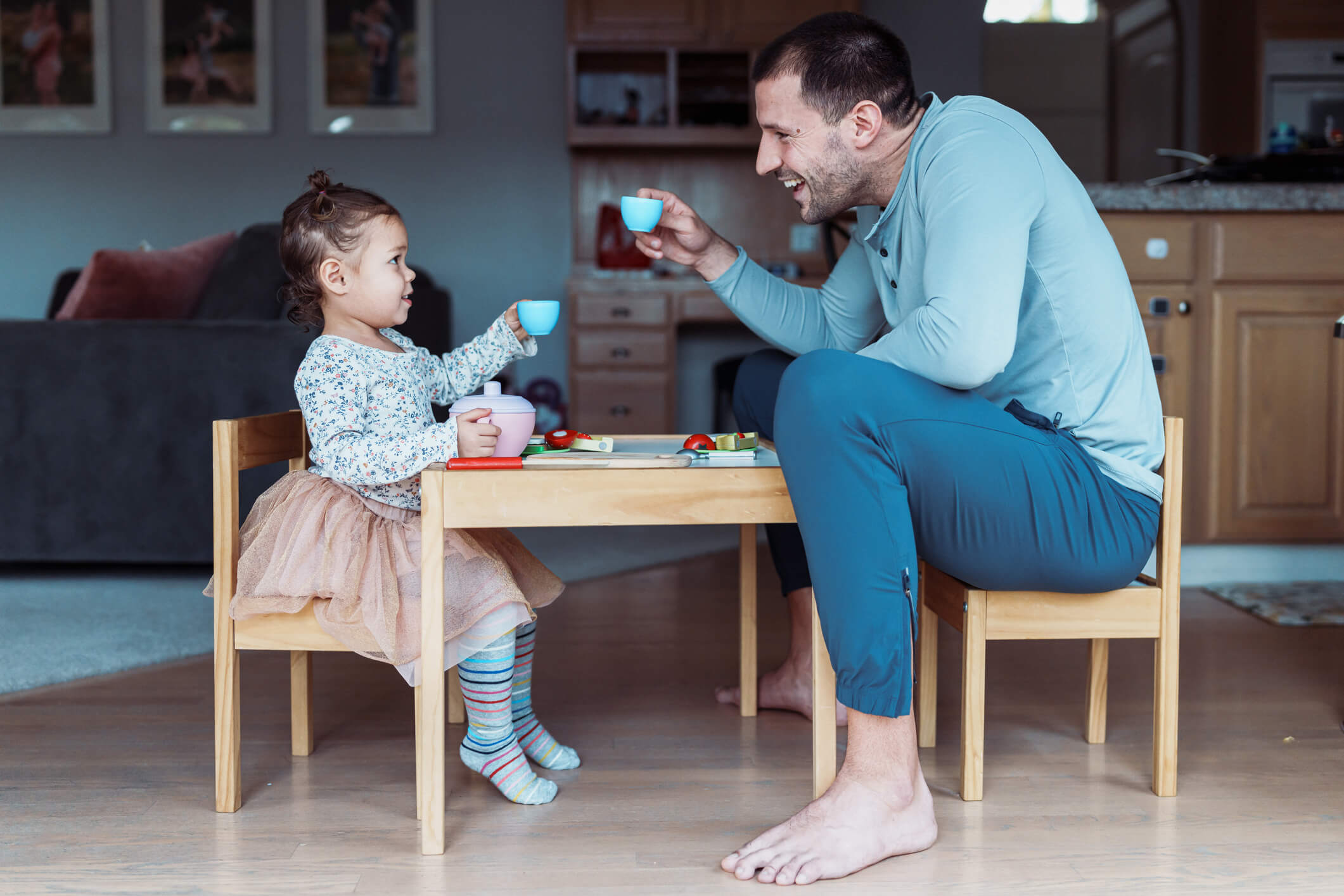 father and daughter having tea